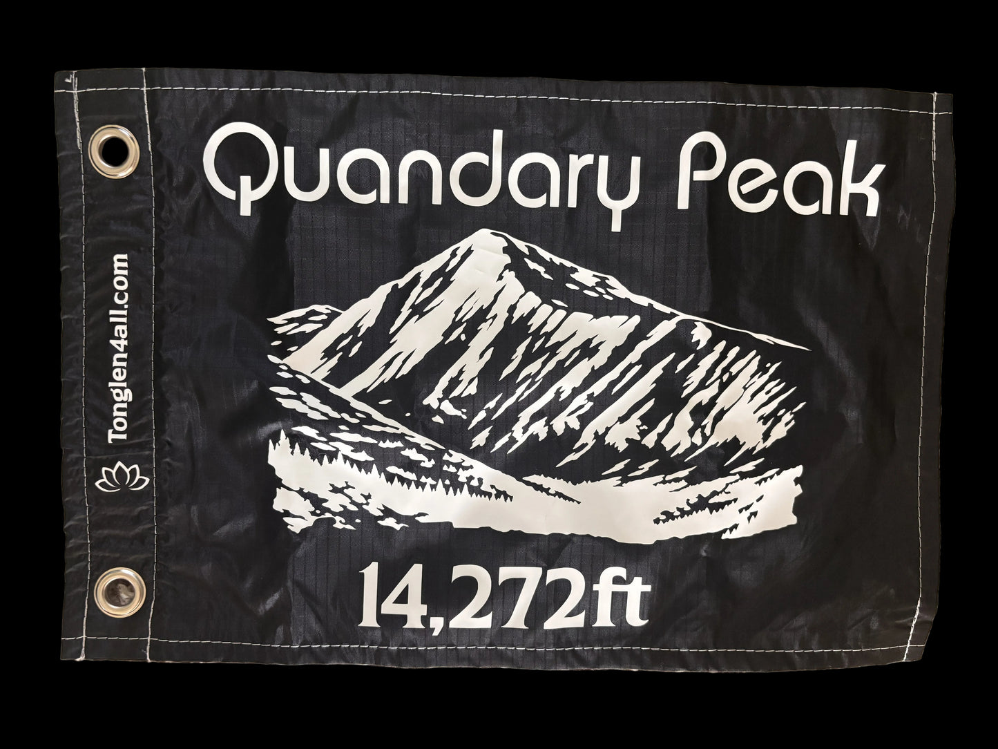 A black fabric flag featuring a white graphic of Mount Quandary Peak with the text 'Quandary Peak' and '14,272ft'. The flag has two metal grommets on the left side and 'Tonglen4all'
