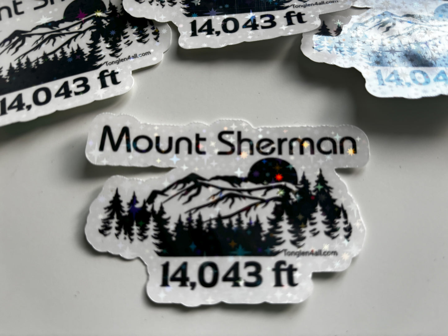 Mount Sherman sticker with mountain and tree design on a gray background