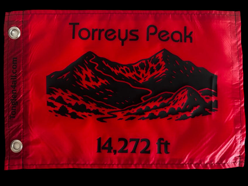 Red flag with black mountain silhouette and text on a white background